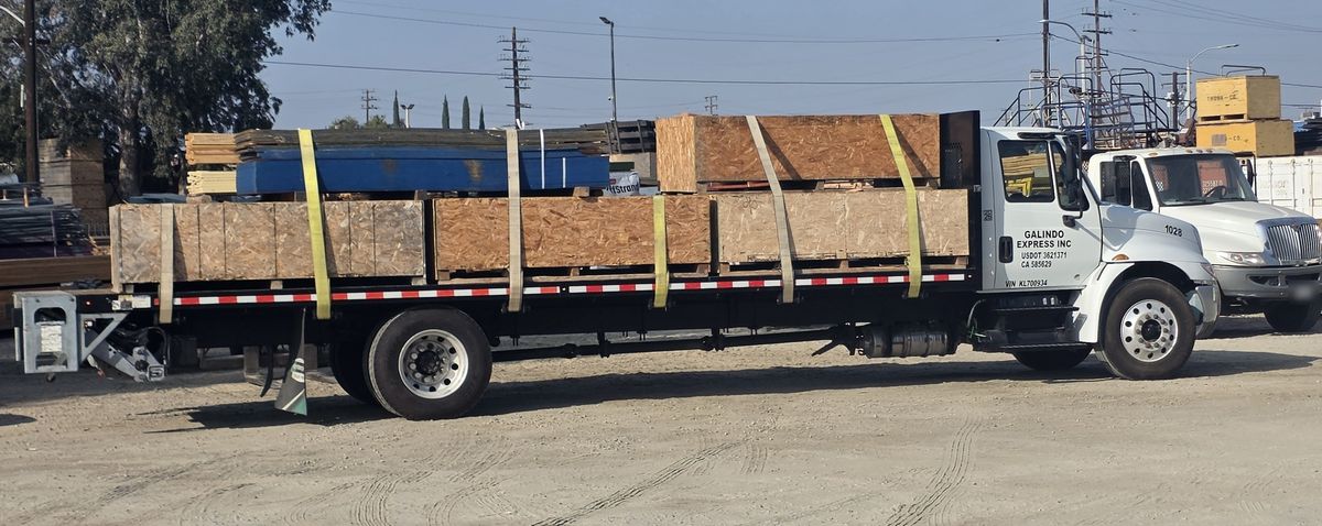 Flatbed truck loaded with building materials